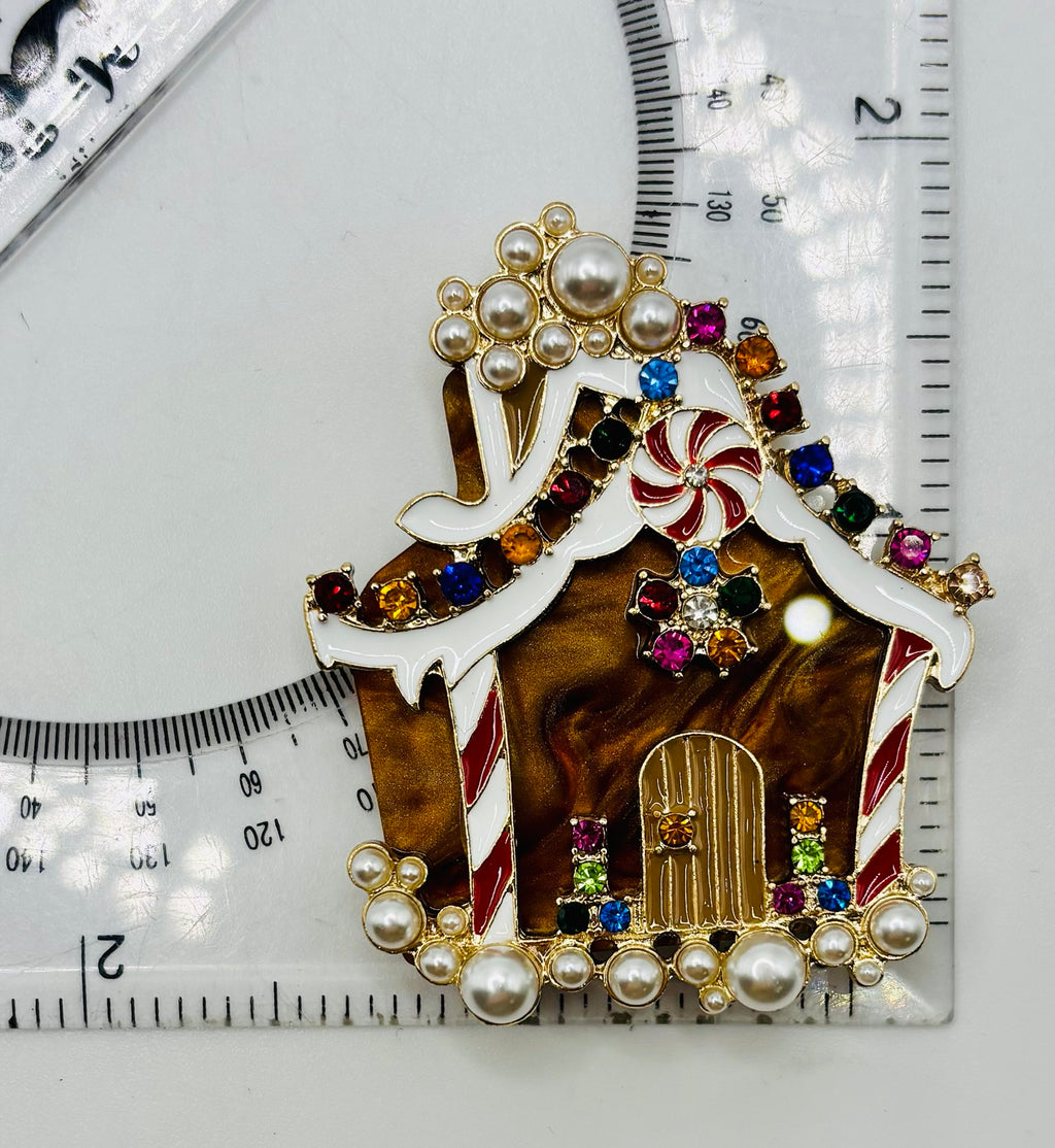 Stunning Crystal Gingerbread House Needle Minder beside a ruler for scale