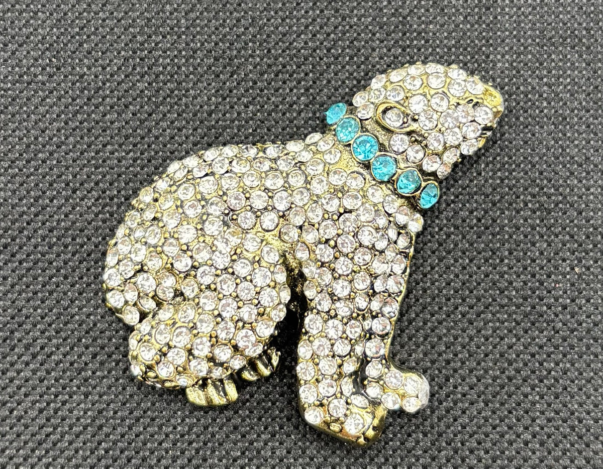 Crystal polar bear needle minder on dark fabric