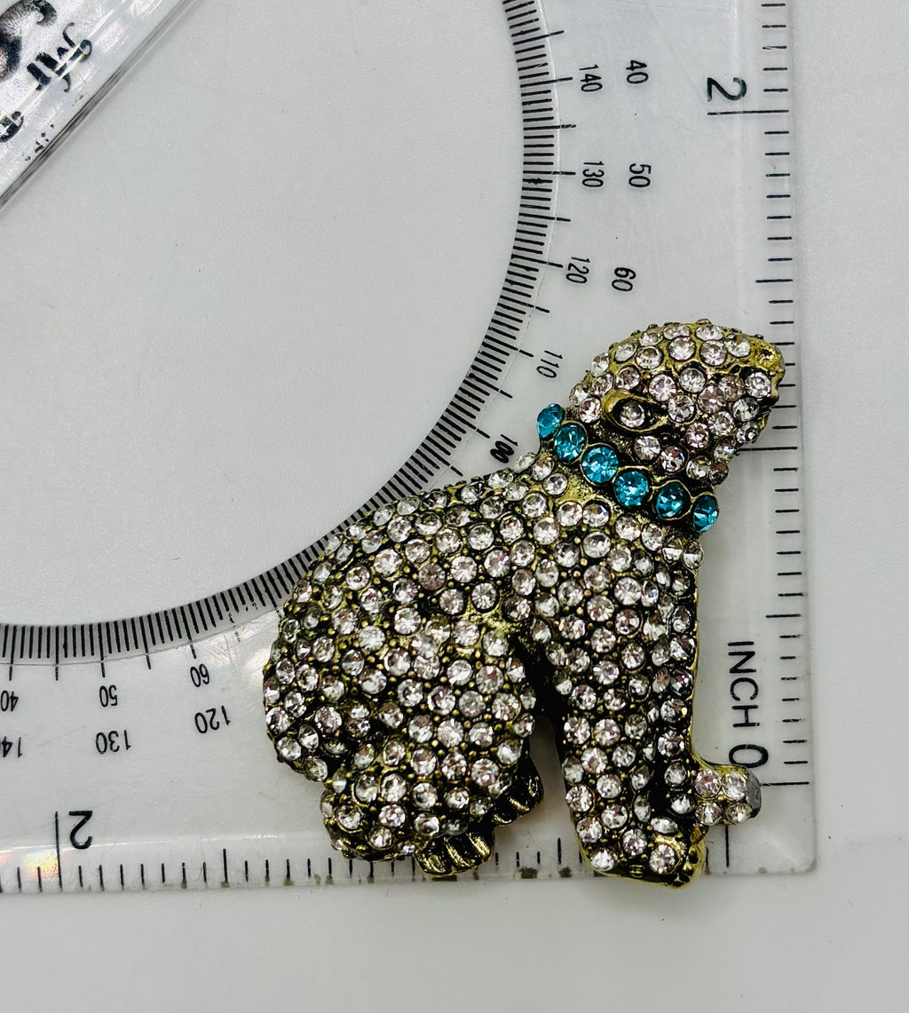 Crystal polar bear needle minder beside ruler for scale