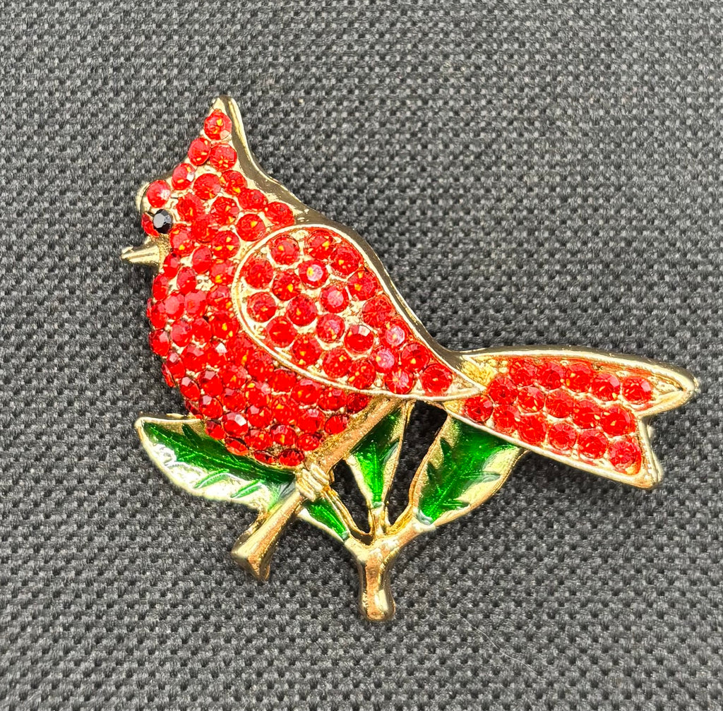Beautiful Crystal Red Cardinal Needle Minder on dark fabric