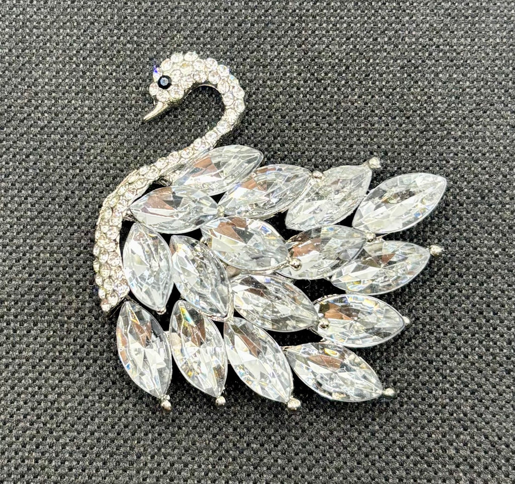 Crystal swan needle minder — dark fabric