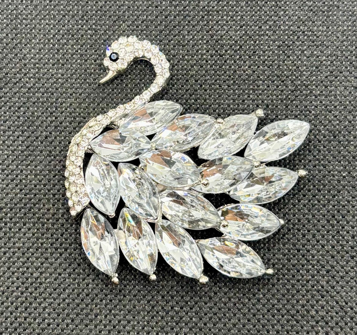 Crystal swan needle minder — dark fabric