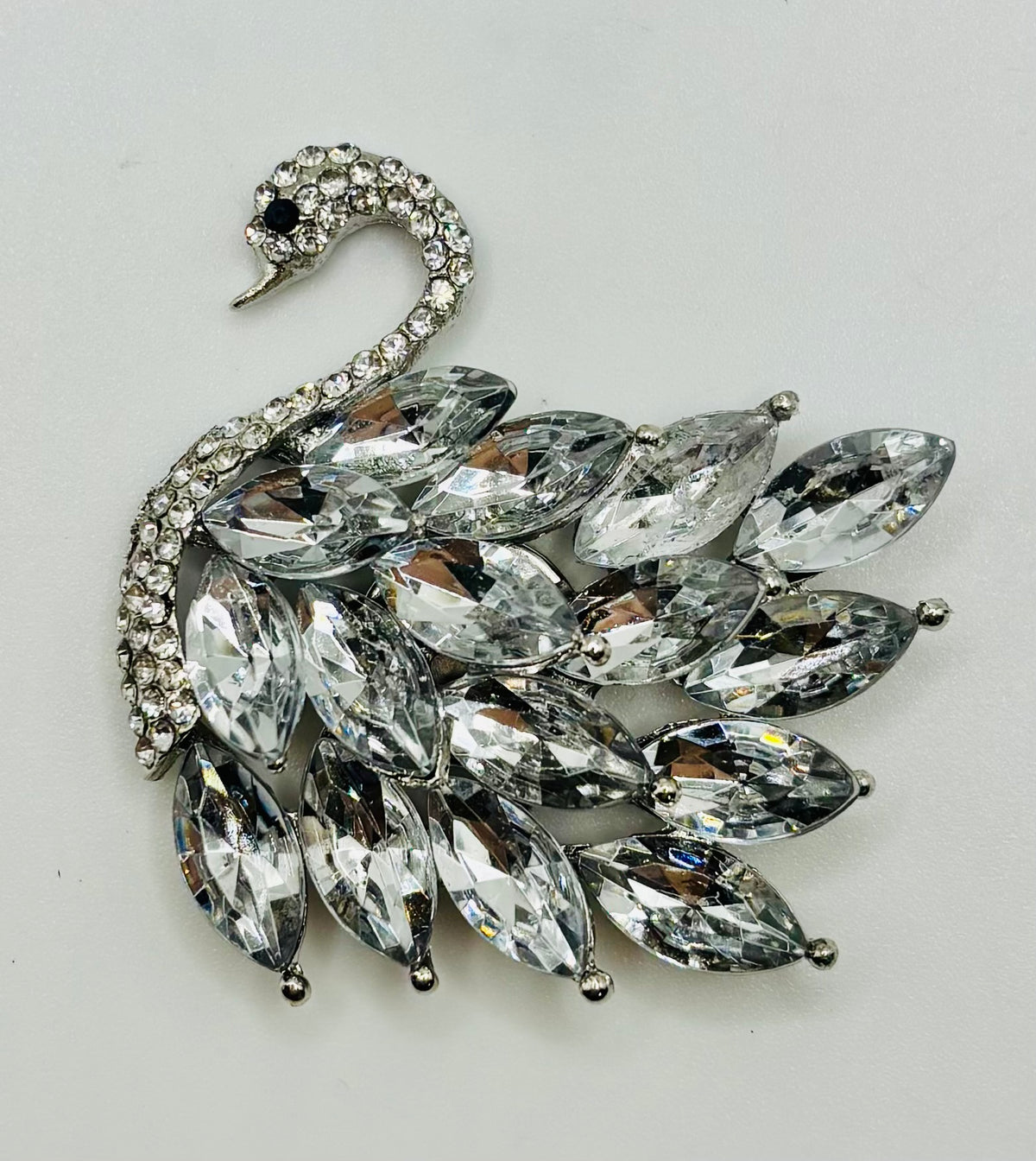 Crystal swan needle minder — white background