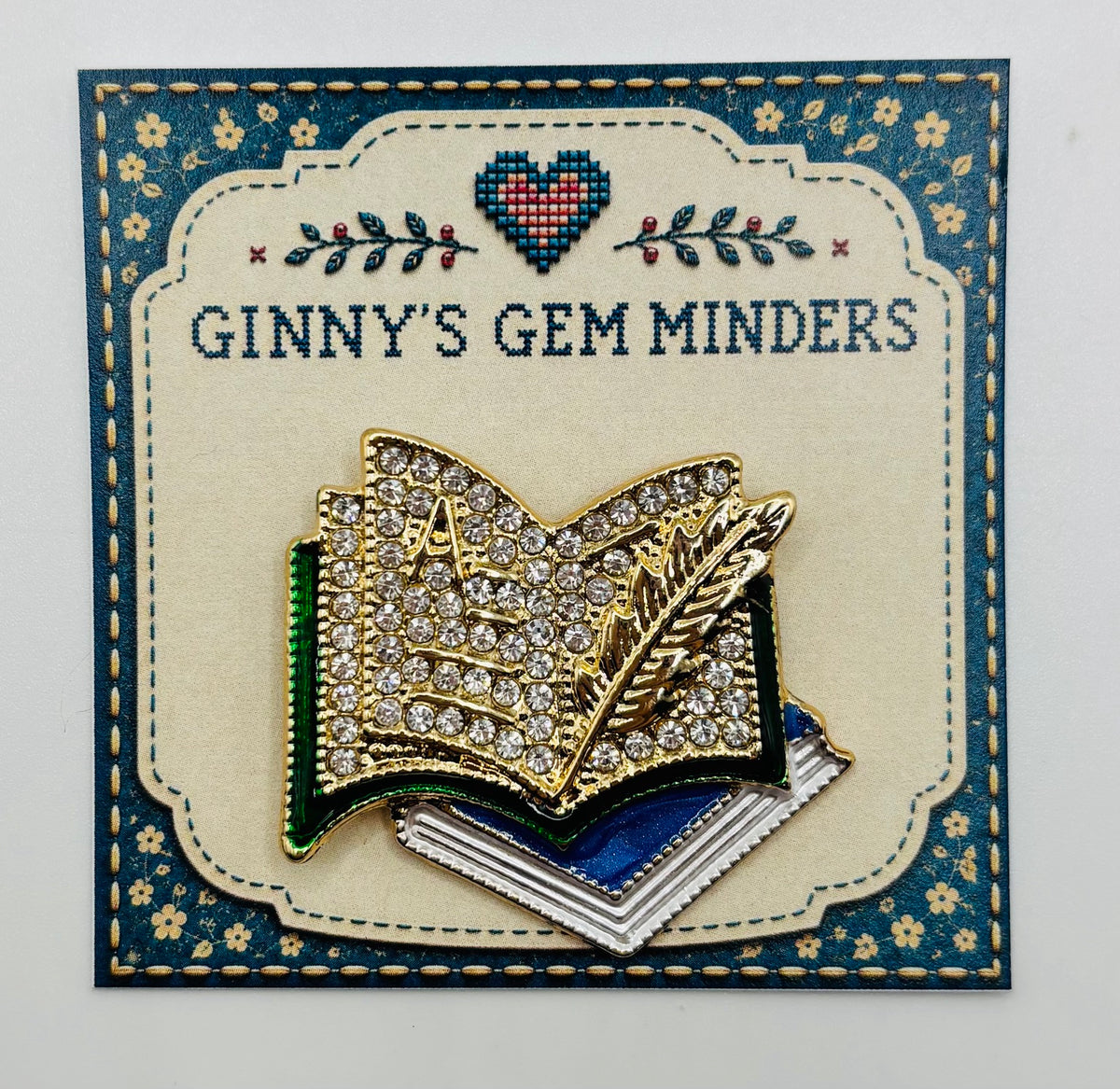 Enamel and Crystal Books Needle Minder — display card