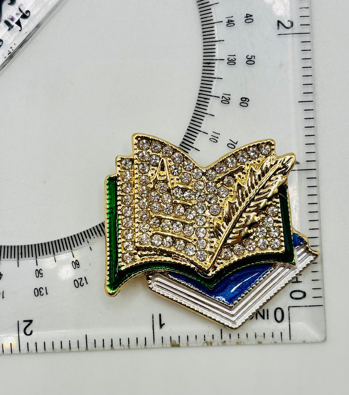Enamel and Crystal Books Needle Minder — ruler