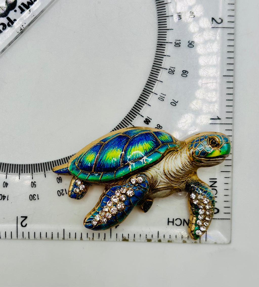 Gorgeous Enamel Crystal Green Sea Turtle Needle Minder beside a ruler for scale