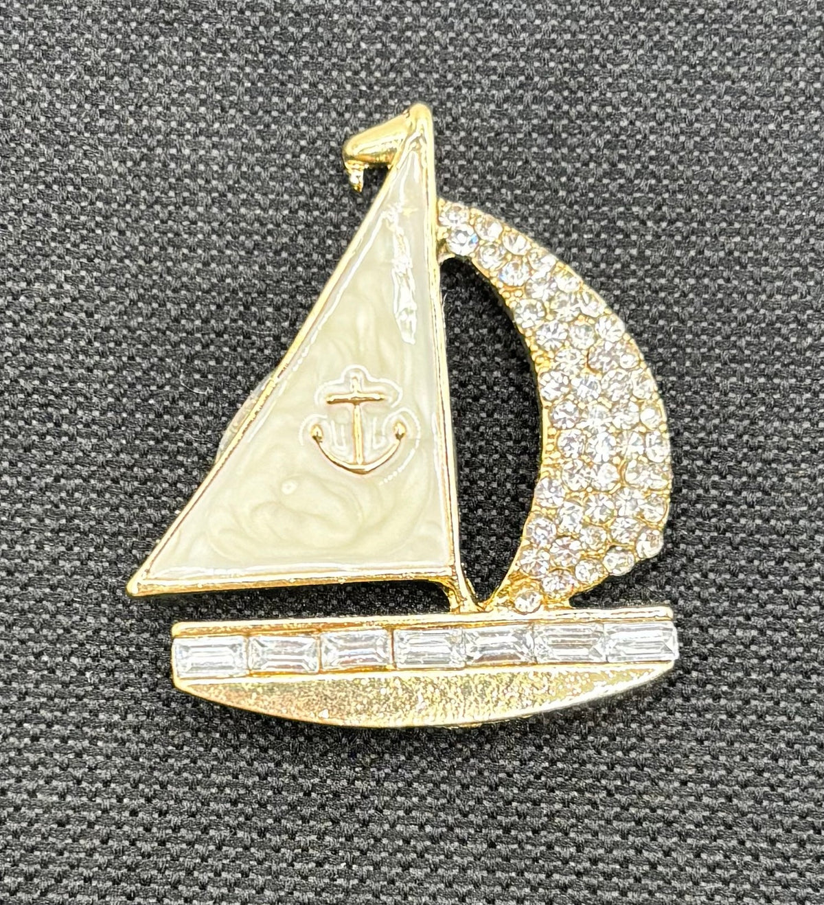 Enamel and crystal sailboat needle minder — dark fabric