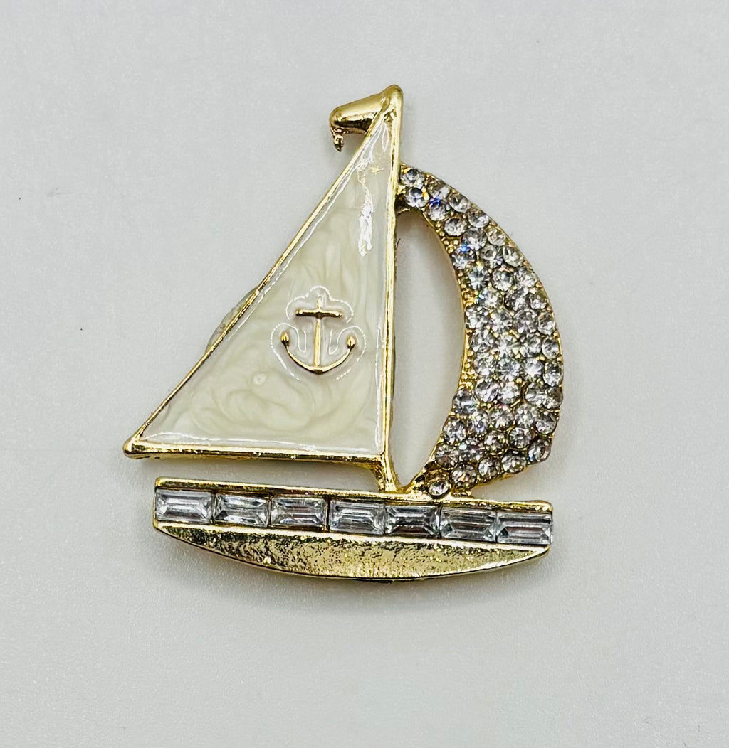 Enamel and crystal sailboat needle minder — white background