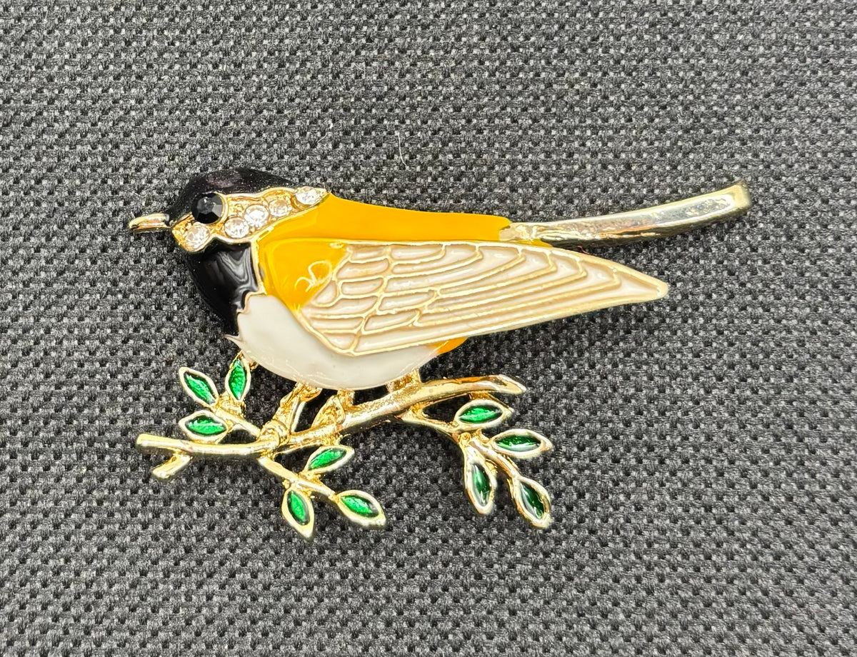 Enamel and crystal goldfinch needle minder — dark fabric