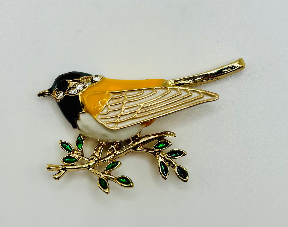 Enamel and crystal goldfinch needle minder — white background
