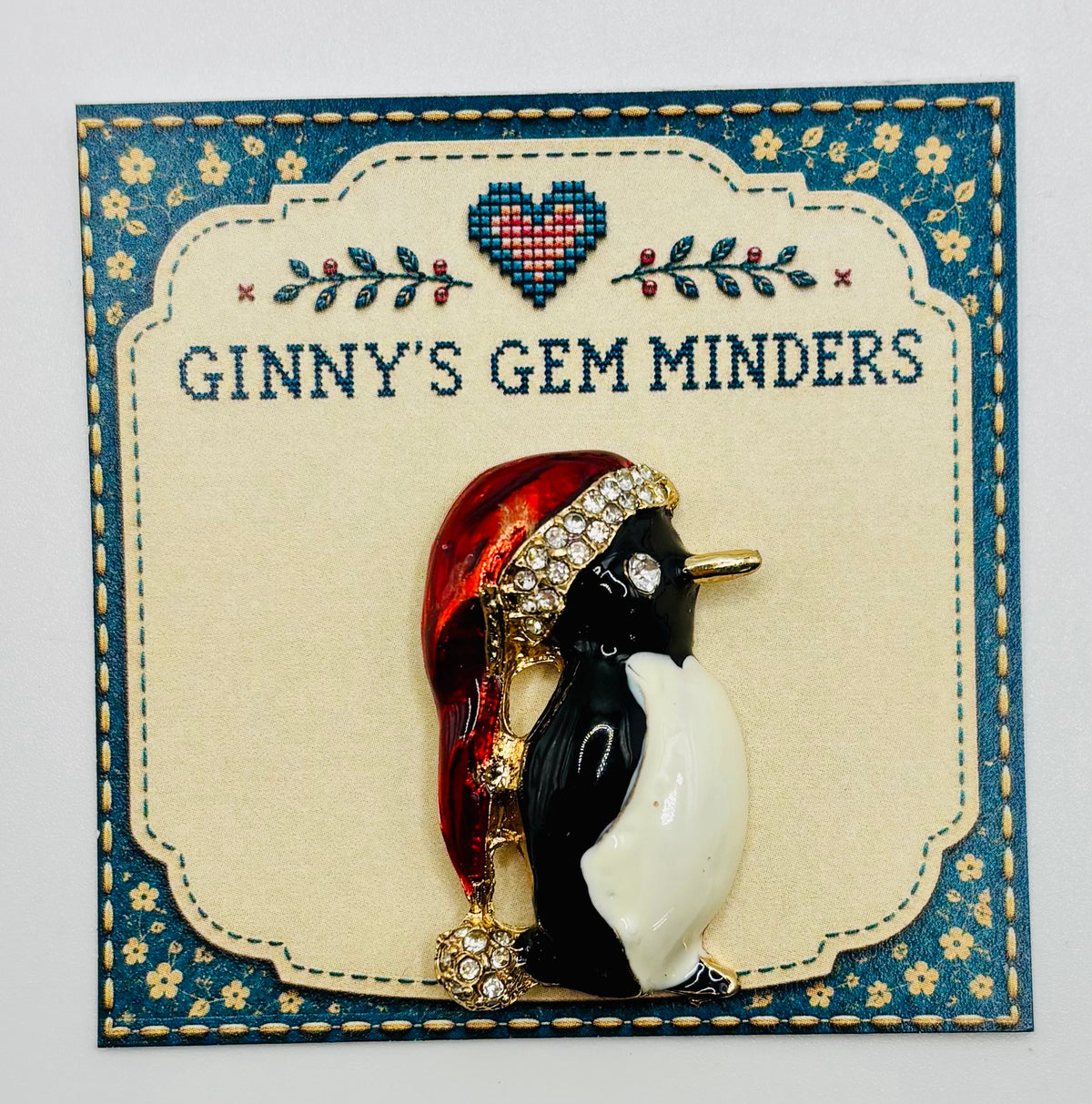 Enamel and crystal penguin needle minder — display card