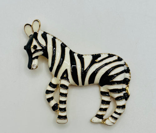 Enamel zebra needle minder on white background