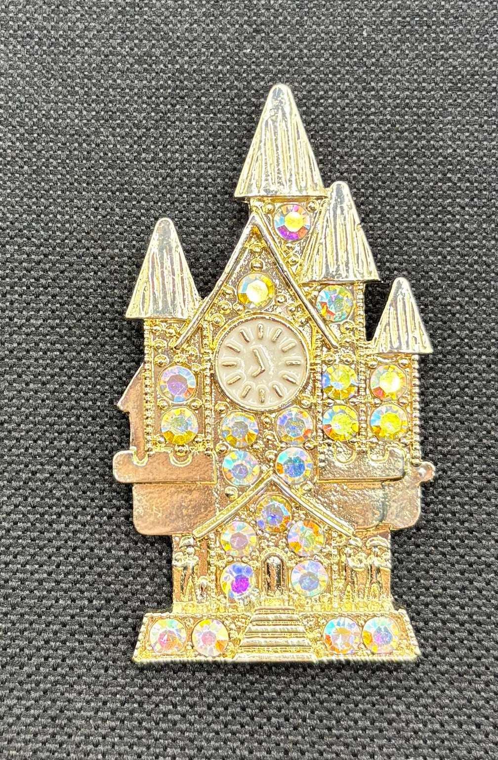Beautiful Gold and Crystal Cinderella’s Castle Needle Minder — dark fabric
