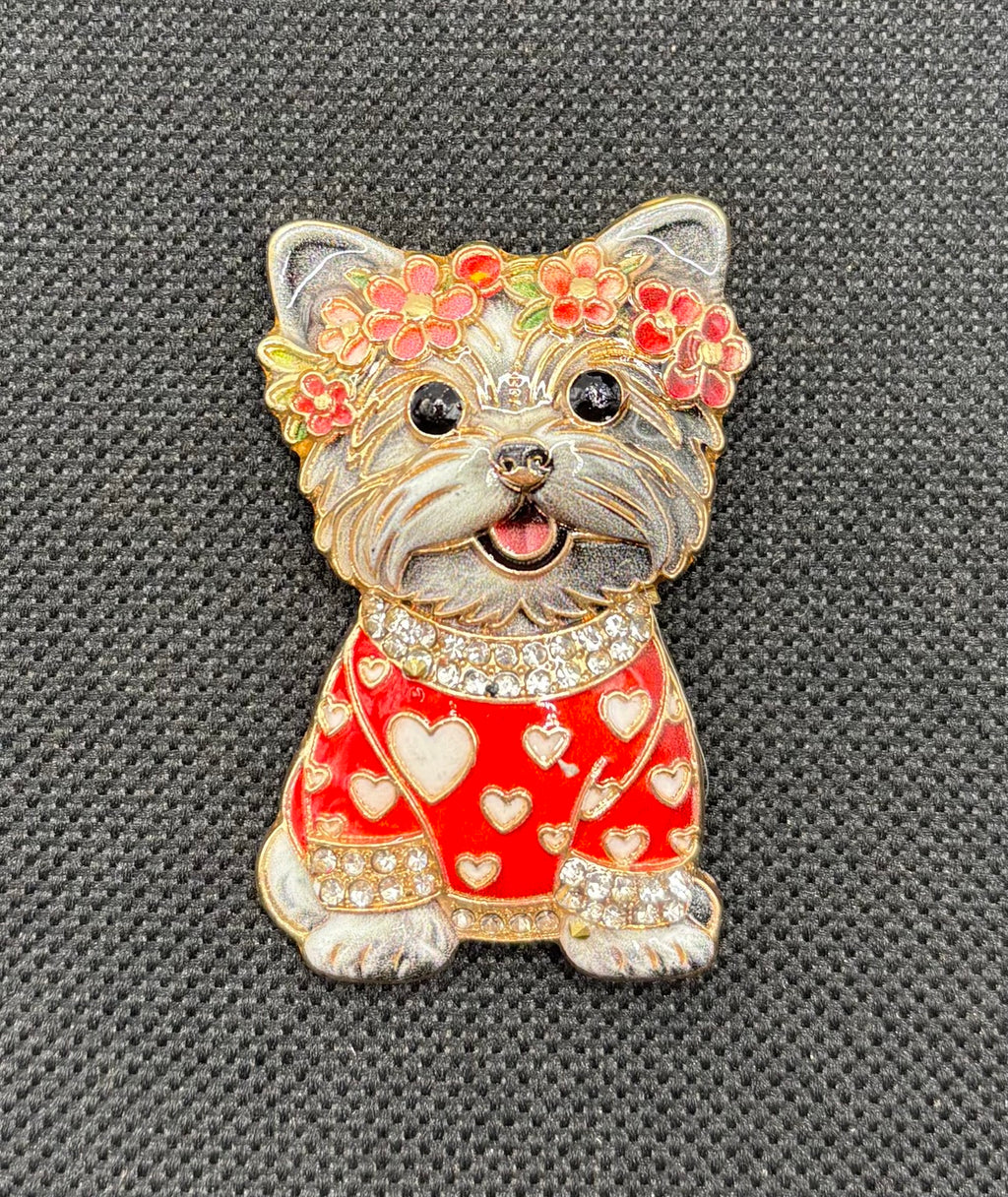 Gray dog in red heart sweater needle minder on dark fabric