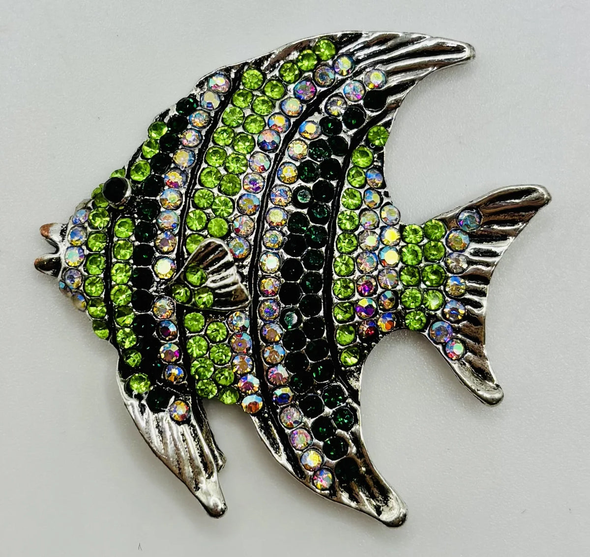 Green crystal angelfish needle minder on a white background