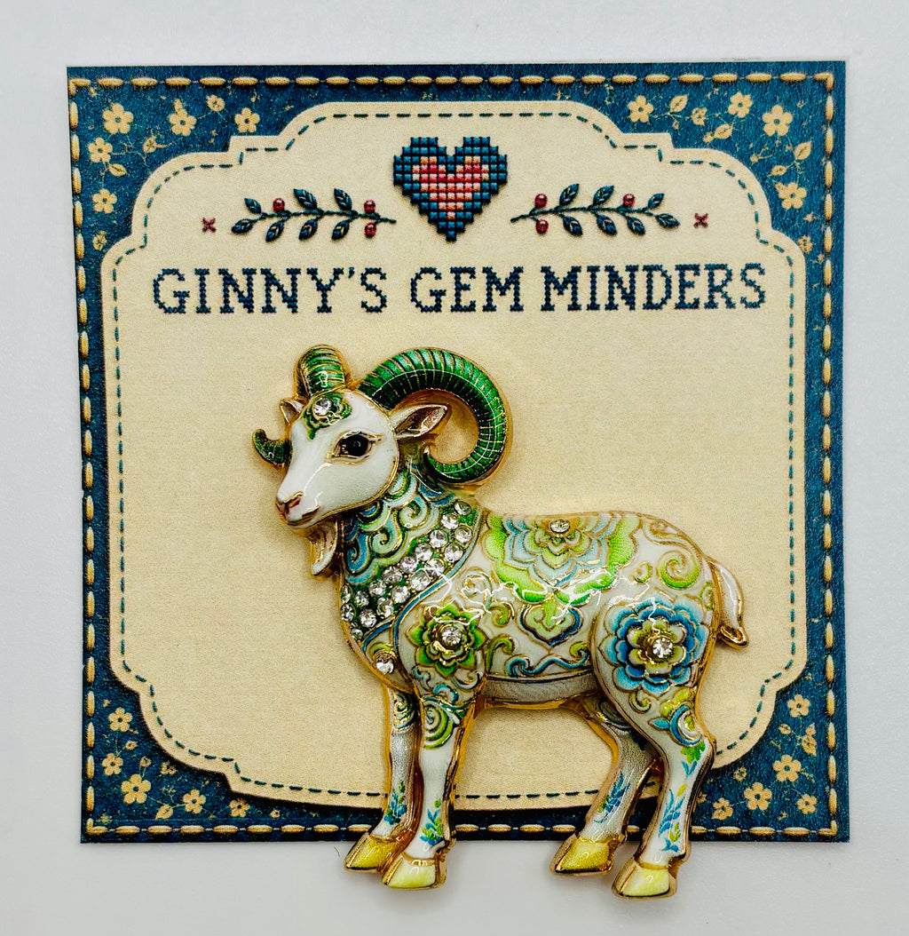 Green floral goat needle minder on display card