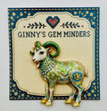 Green floral goat needle minder on display card