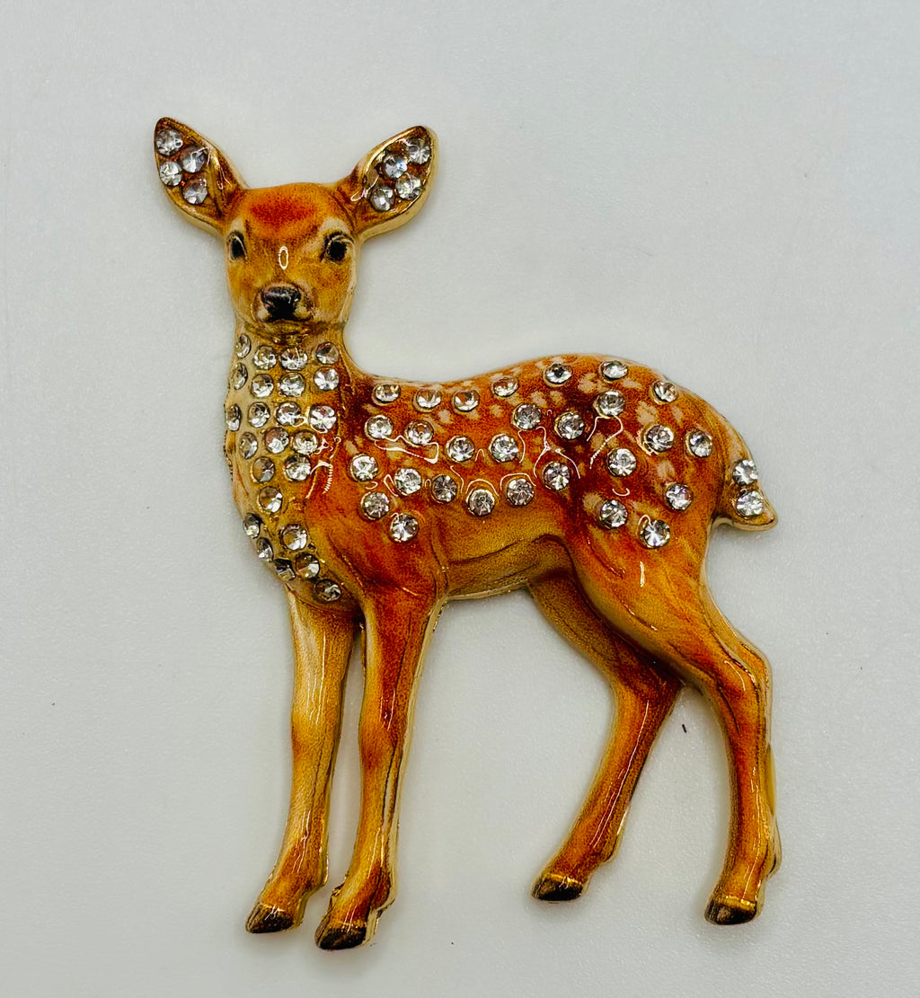 Jeweled doe deer needle minder on white background