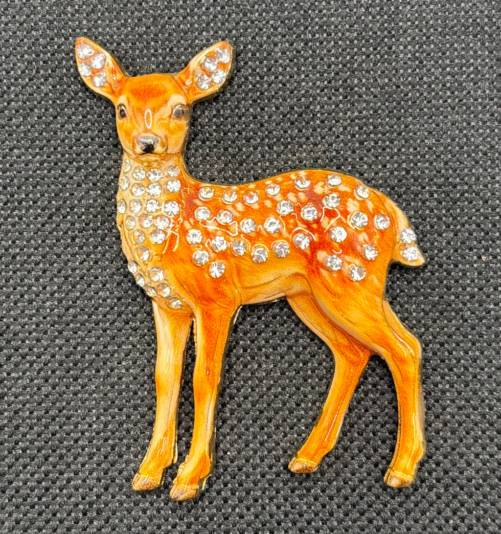 Jeweled doe deer needle minder on dark fabric