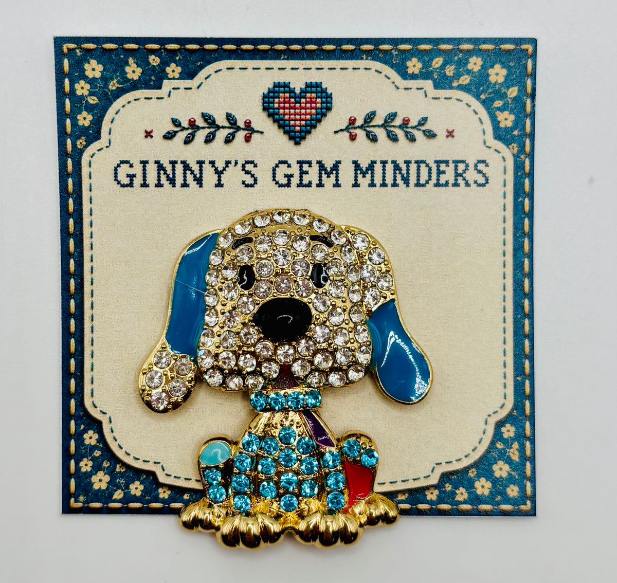 Large blue crystal dog needle minder on display card