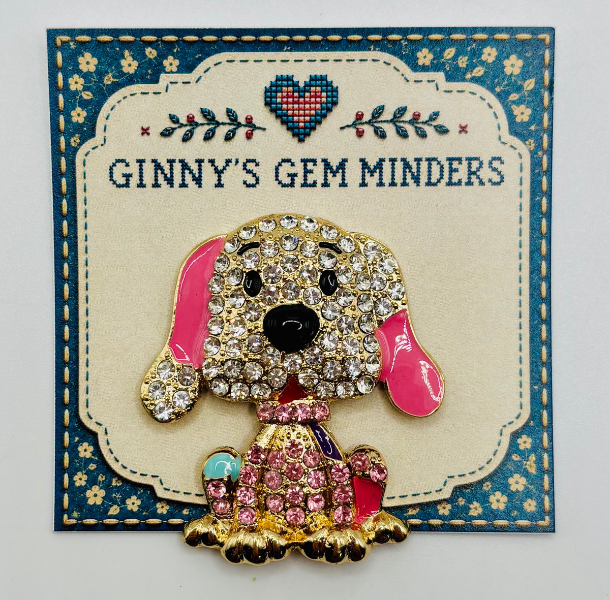 Large pink crystal dog needle minder on display card