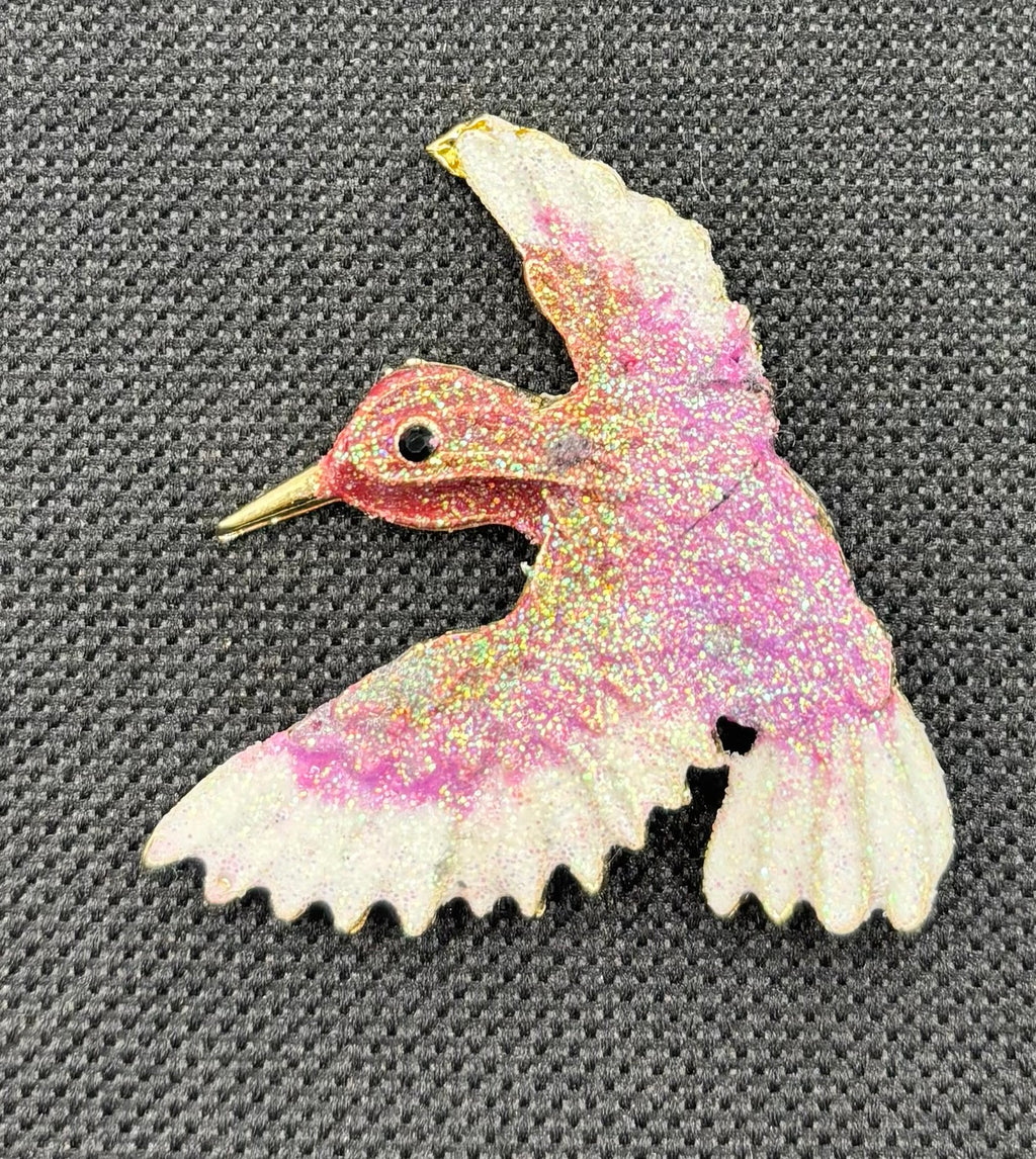 Lavender and white glittery hummingbird needle minder — dark fabric