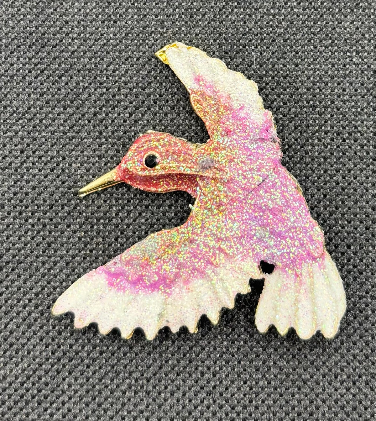 Lavender and white glittery hummingbird needle minder — dark fabric