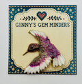 Lavender and white glittery hummingbird needle minder — display card