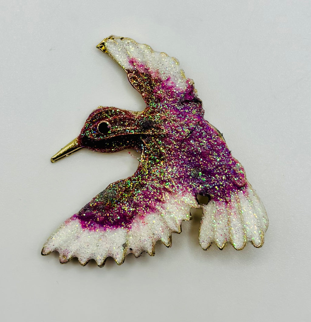Lavender and white glittery hummingbird needle minder — white background