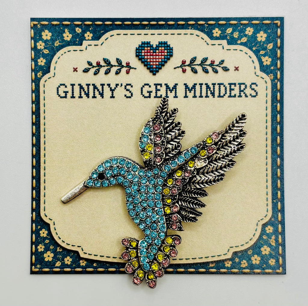 Light blue crystal hummingbird needle minder — display card
