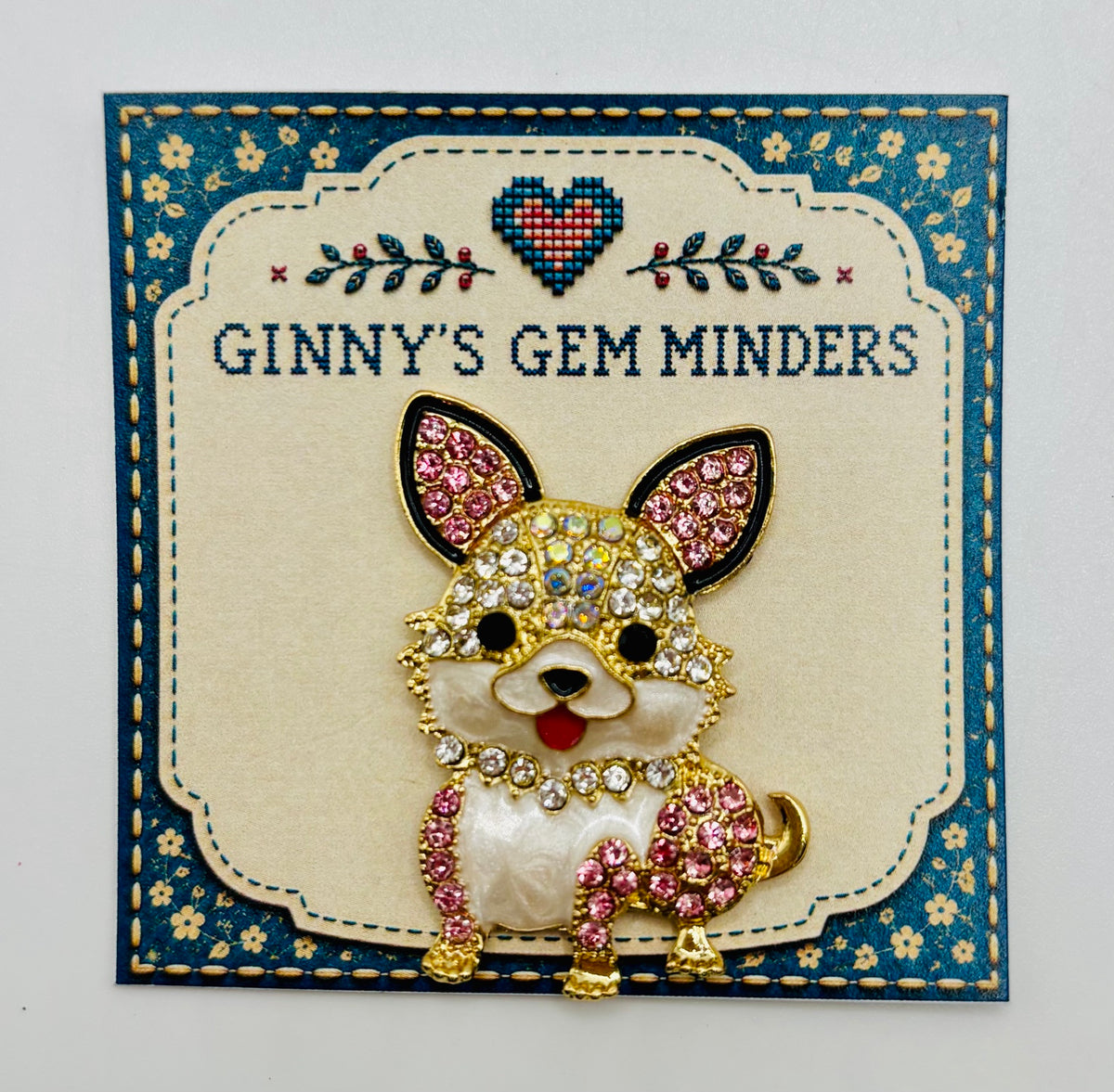 Little pink and clear crystal dog needle minder on display card