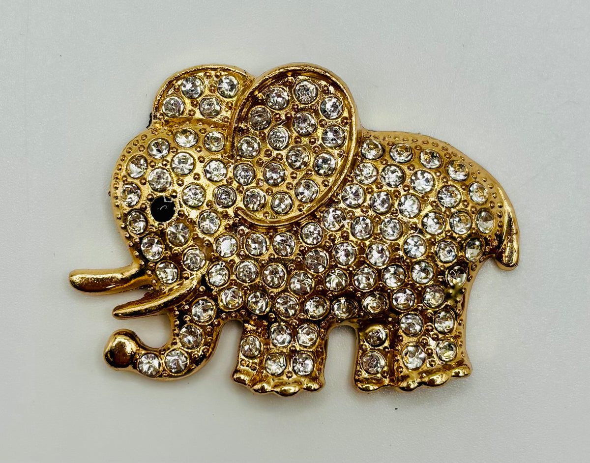 Crystal elephant needle minder on white background