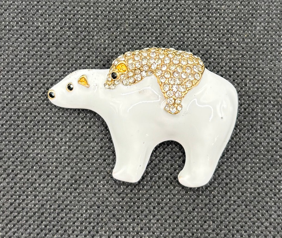Momma and baby polar bear needle minder on dark fabric