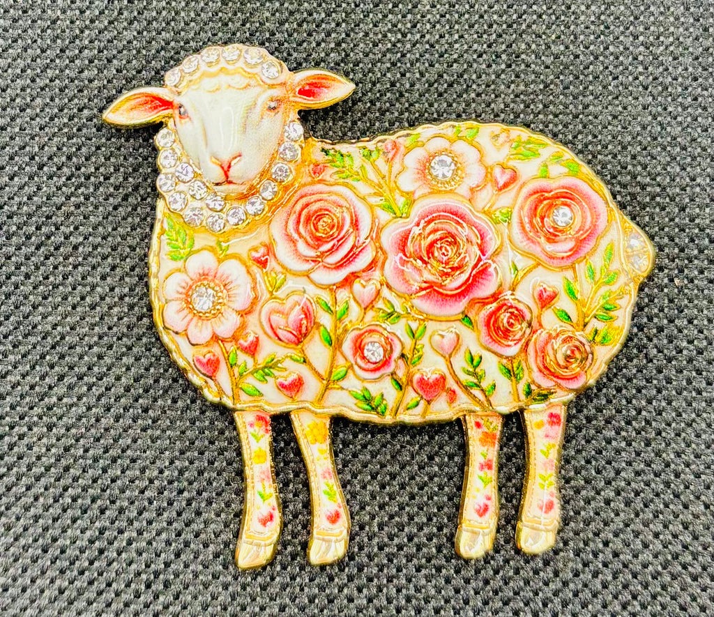 Pink flower sheep needle minder on dark fabric