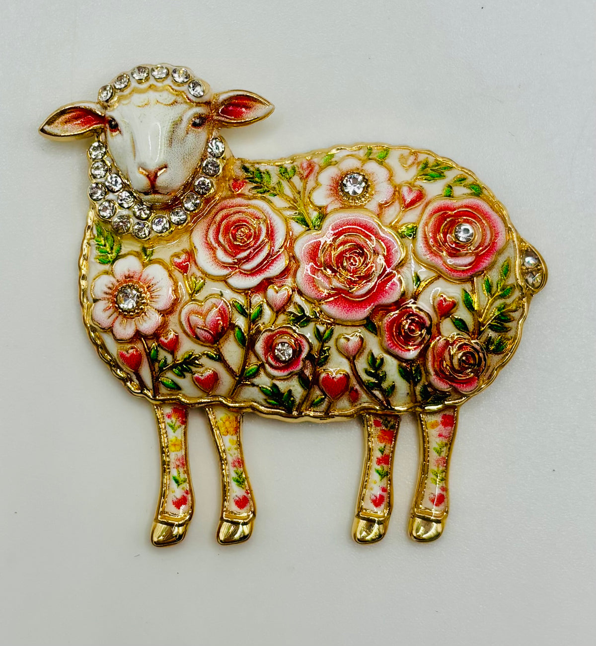Pink flower sheep needle minder on white background