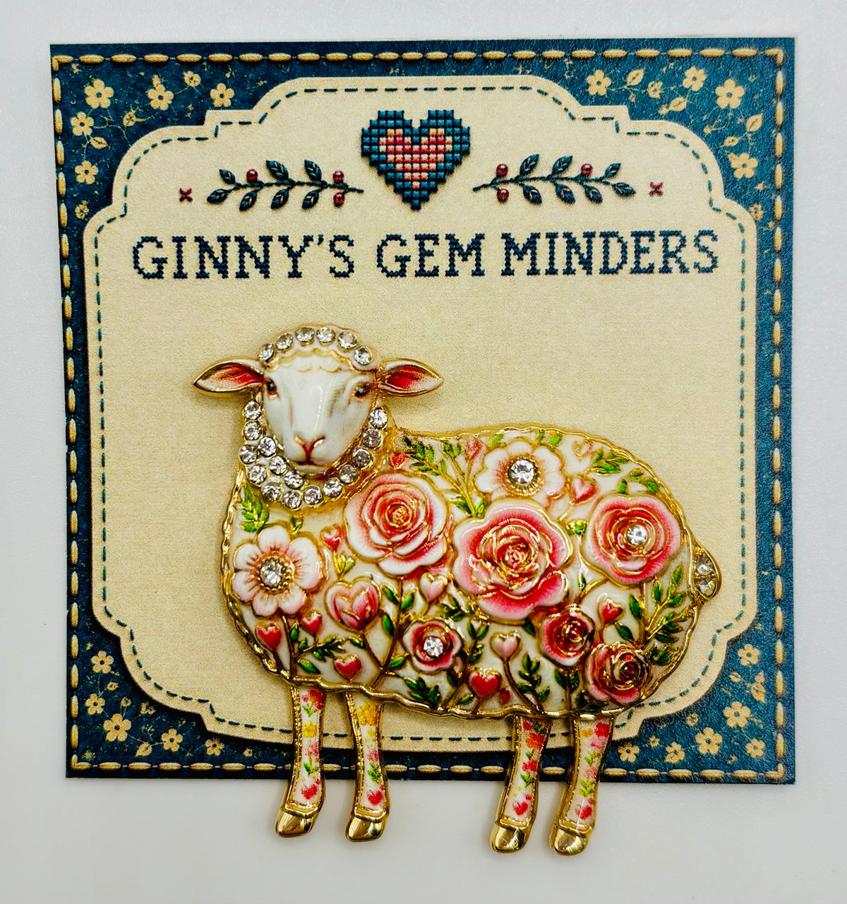 Pink flower sheep needle minder on display card