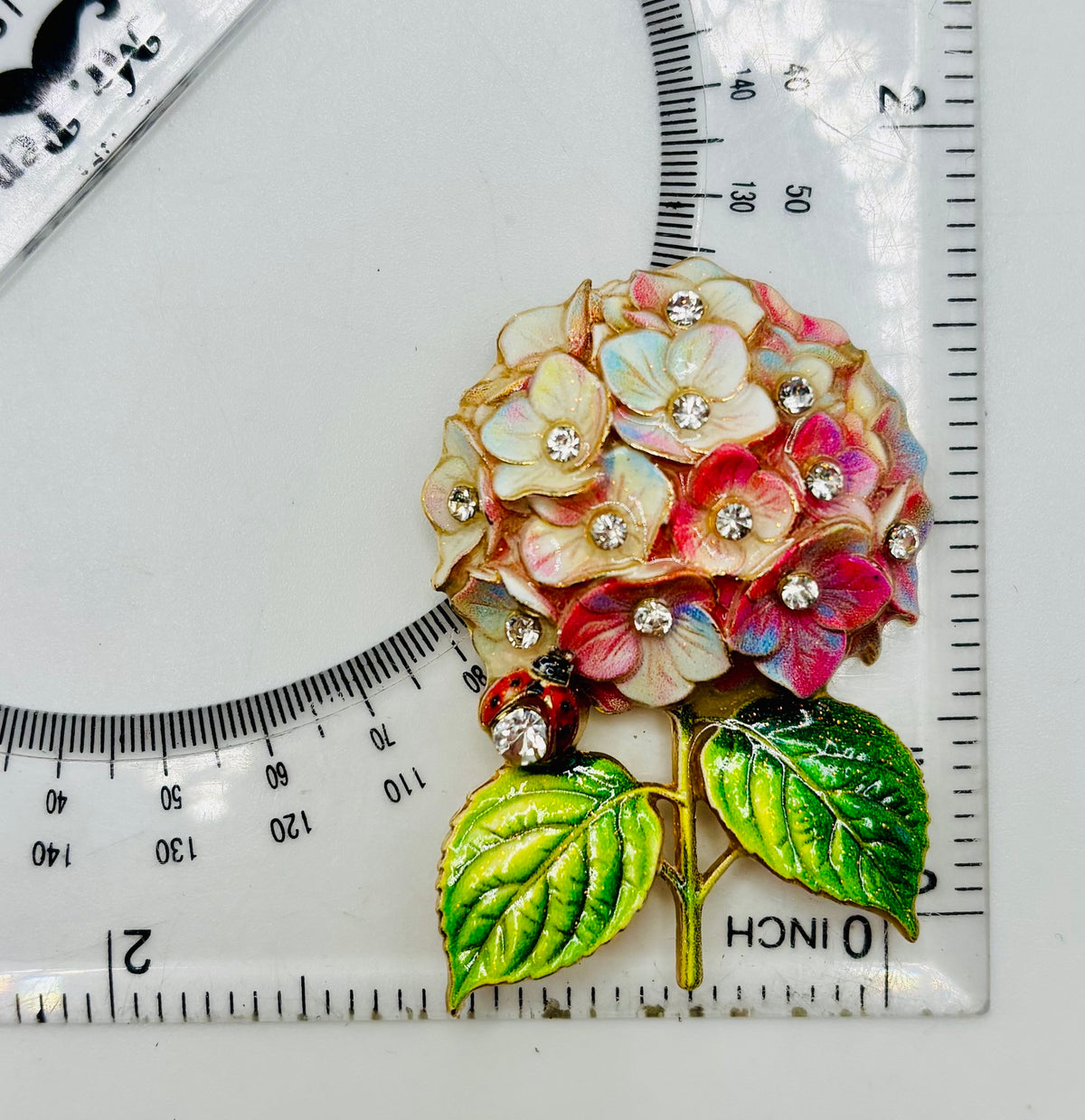 Stunning Pink Hydrangea Needle Minder beside a ruler for scale