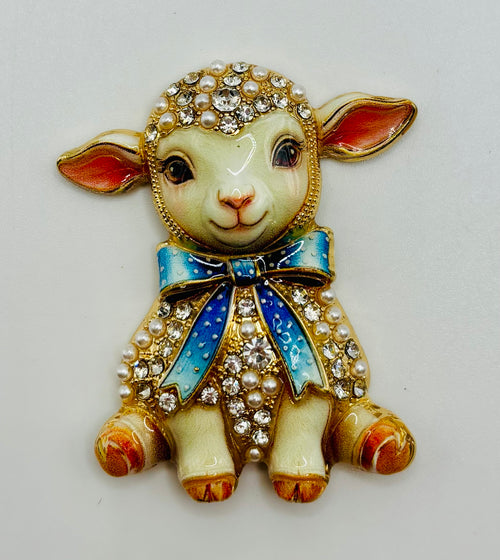 Blue bow lamb needle minder on white background