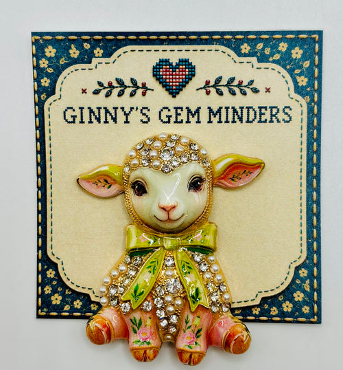 Pink lamb green bow needle minder on display card