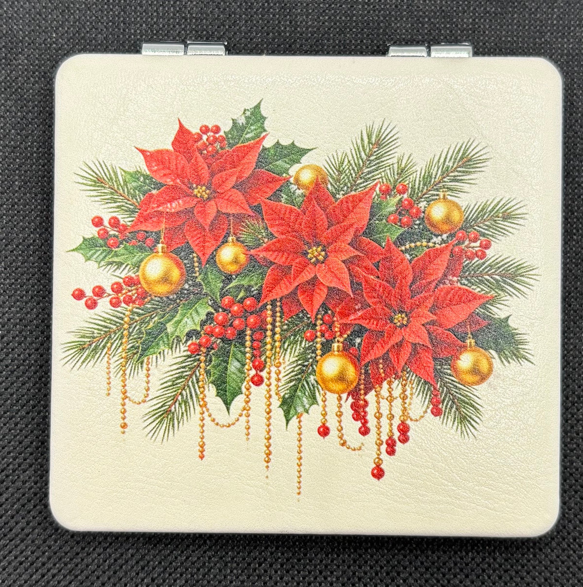 Poinsettia Garland Bead Case on dark fabric