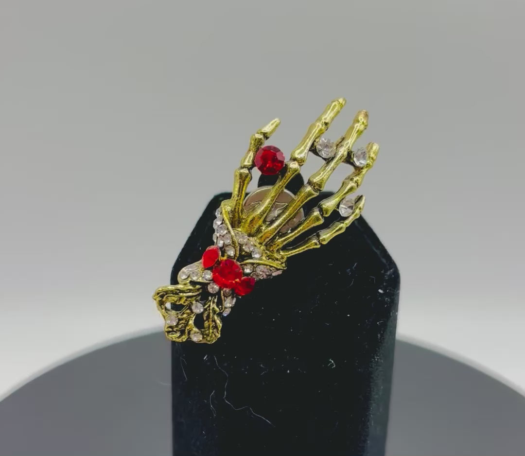 Cool Gold and Crystal Skeleton Hand Needle Minder