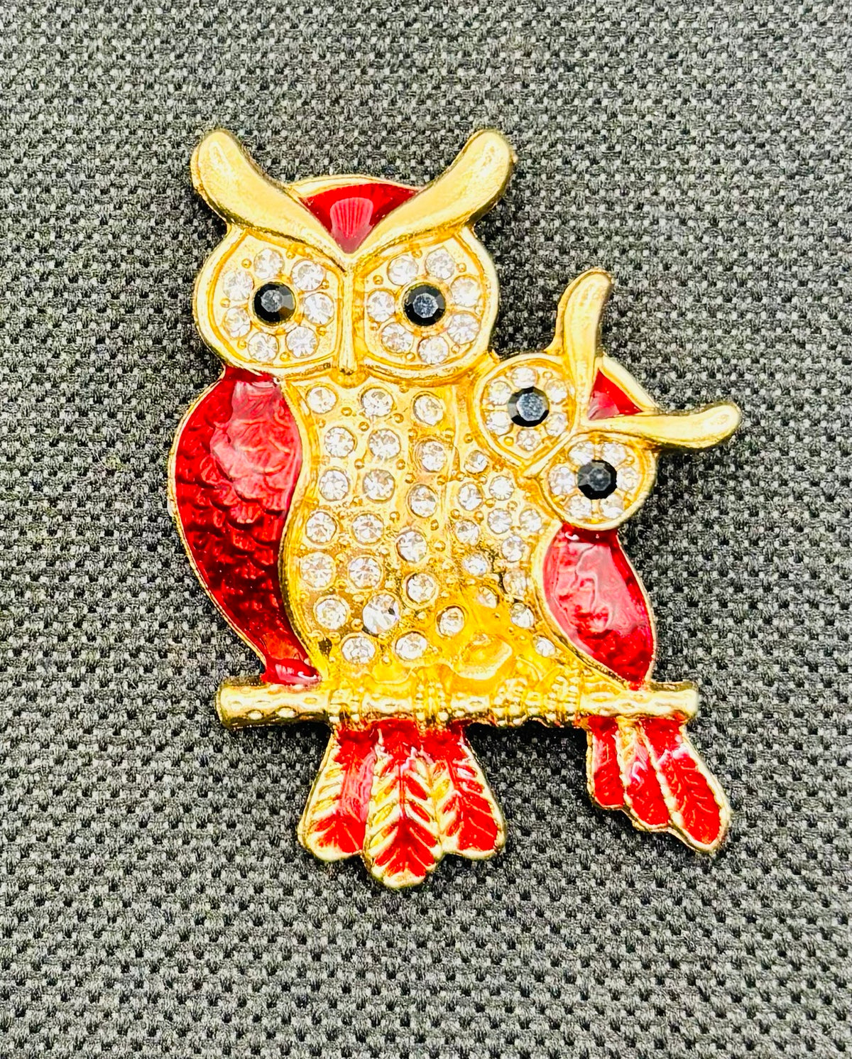 Red enamel and crystal owl pair needle minder — dark fabric