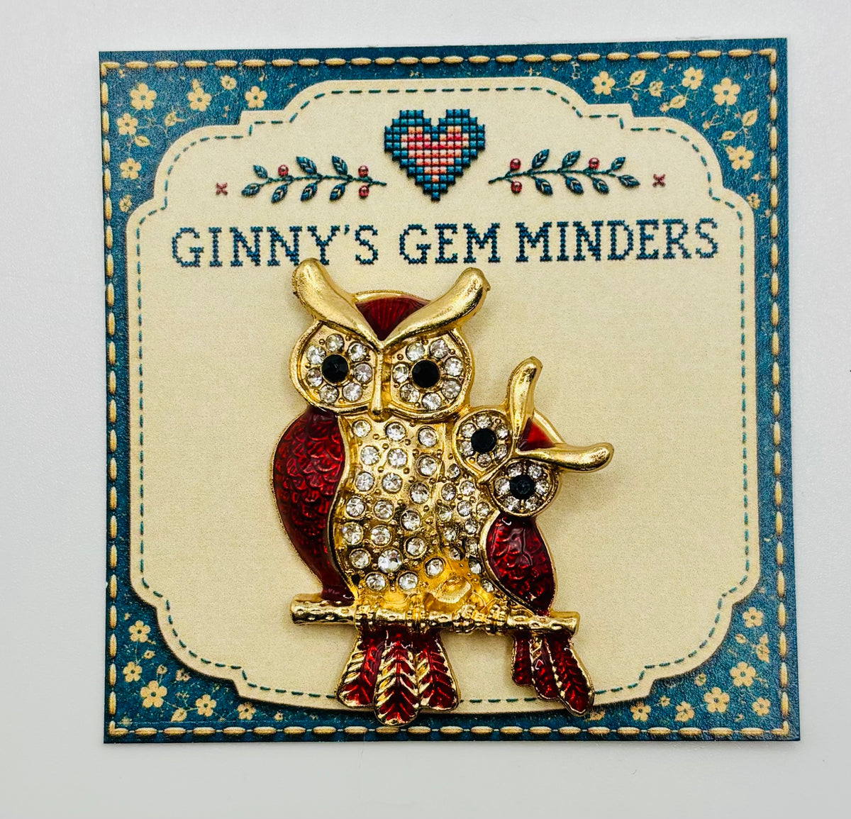 Red enamel and crystal owl pair needle minder — display card