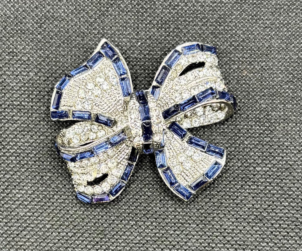 Beautiful Sapphire Blue and Crystal Bow Needle Minder — dark fabric