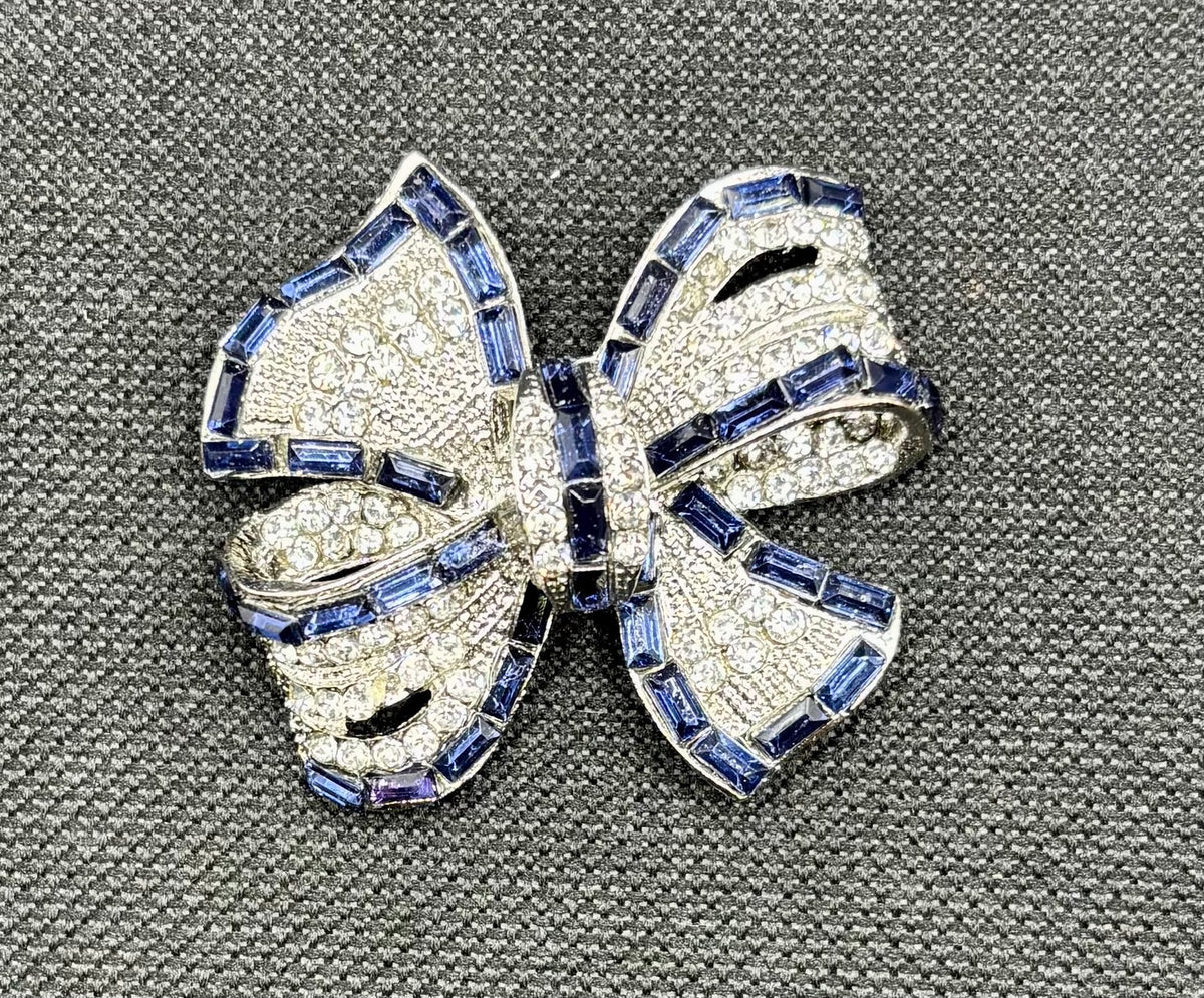 Beautiful Sapphire Blue and Crystal Bow Needle Minder — dark fabric