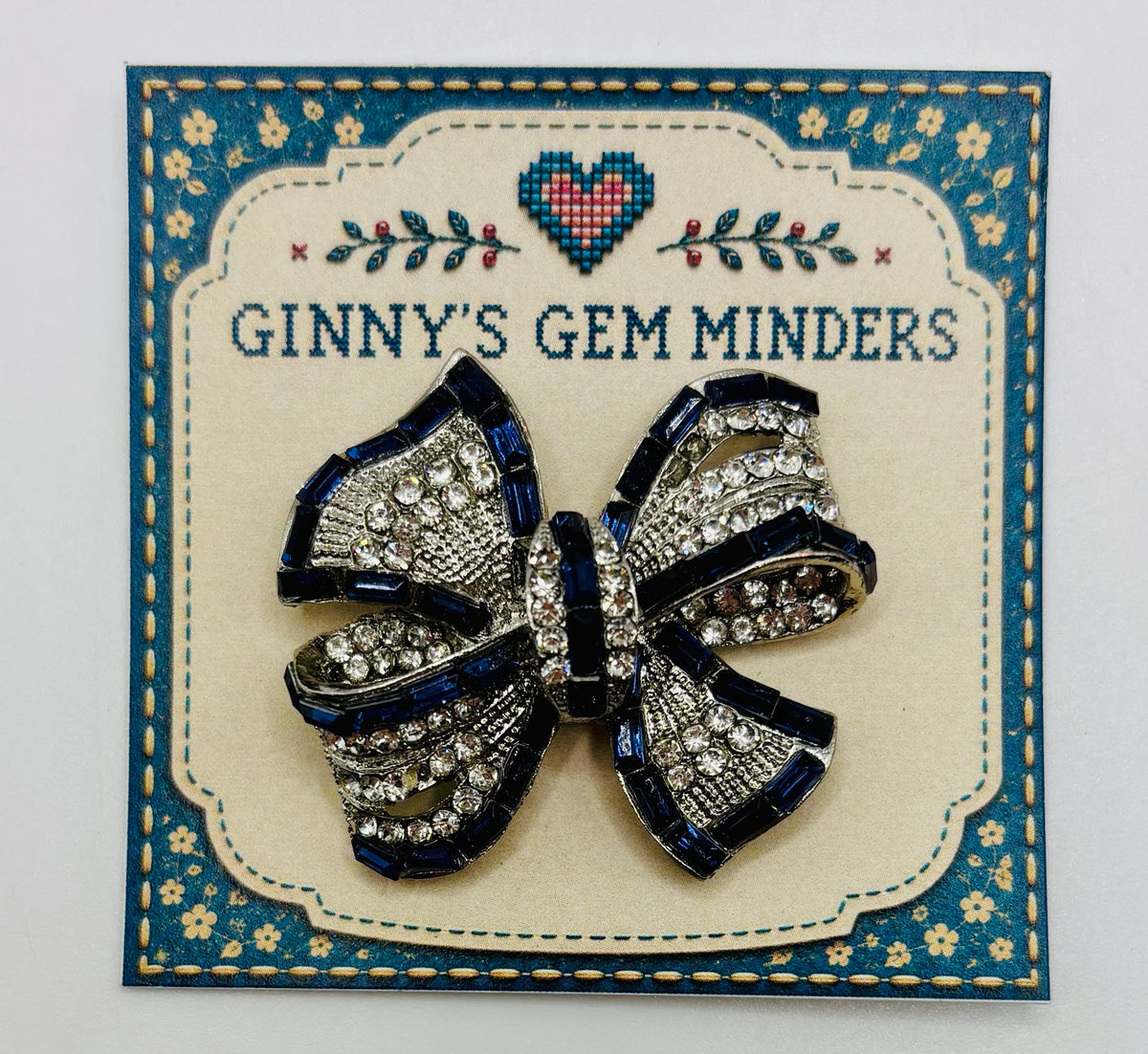 Beautiful Sapphire Blue and Crystal Bow Needle Minder — display card