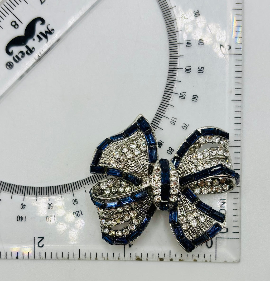 Beautiful Sapphire Blue and Crystal Bow Needle Minder — ruler for scale