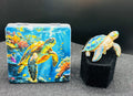 Underwater sea turtle bead case paired with a blue enamel and crystal sea turtle needle minder