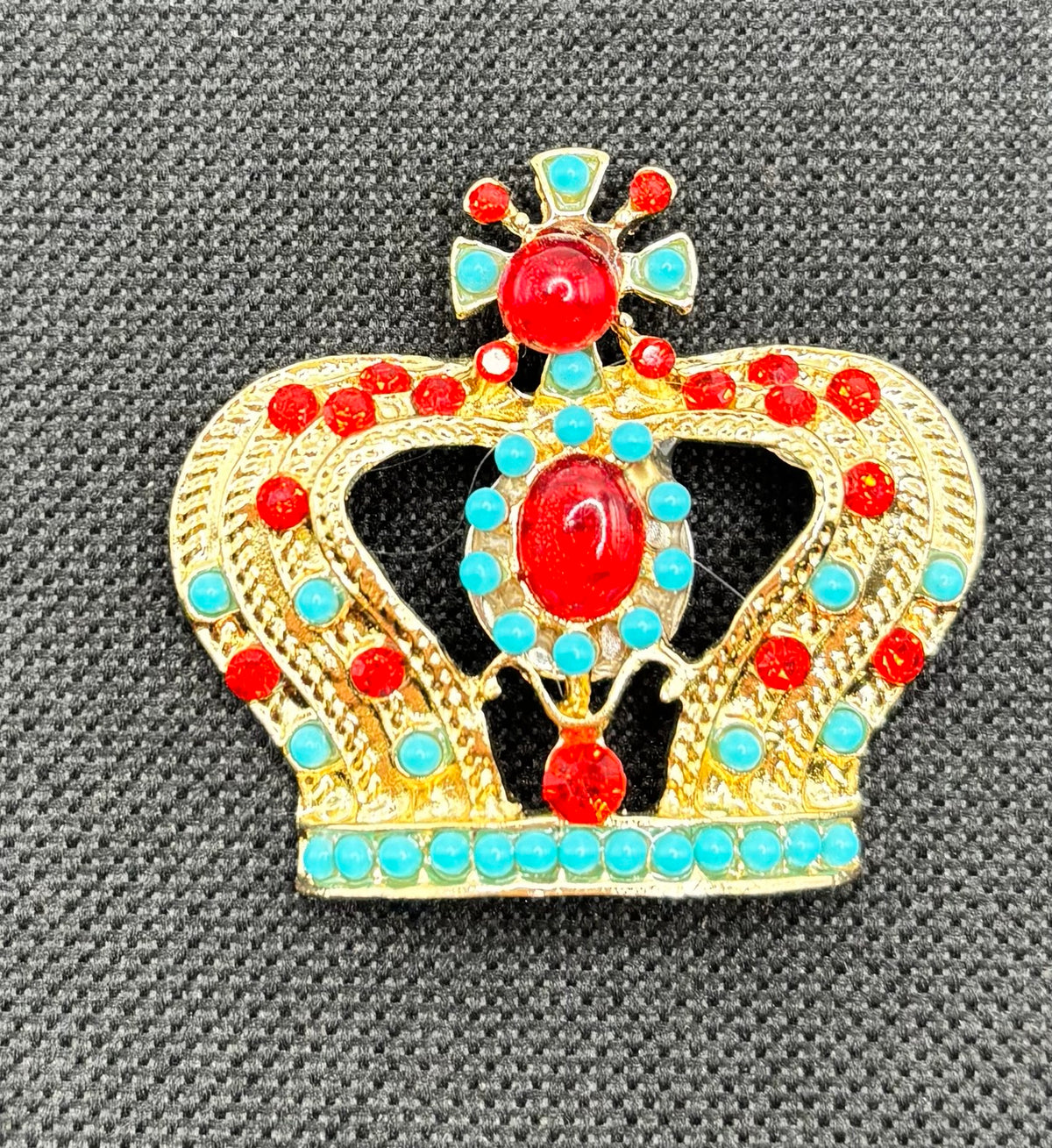 Beautiful Turquoise Bead Red Crystal Crown Needle Minder — dark fabric